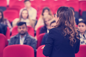 businesswoman giving presentations at conference room