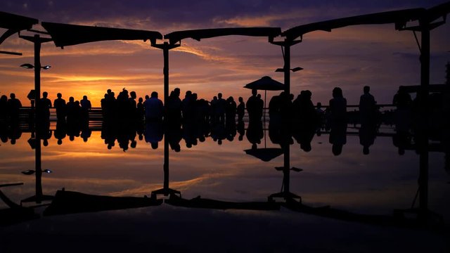 Tourists viewing the sunset at the Larcomar Metropolitan shopping Centre complex Miraflores district Lima Peru South America