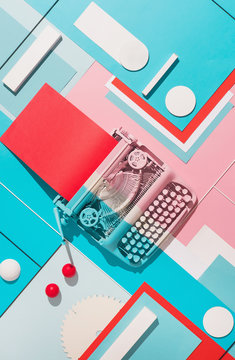 Typing machine in colorful composition.