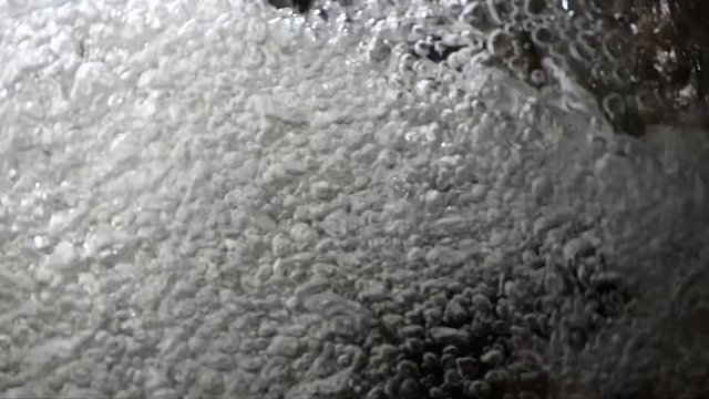 Super slow underwater bubbles rising to surface close up abstract background, HD 1080 video footage.