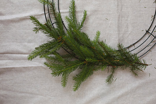 Creating a Christmas wreath from plant foliage and native Australian flowers.