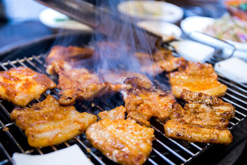Cooking Korean style barbeque pork and deodeok