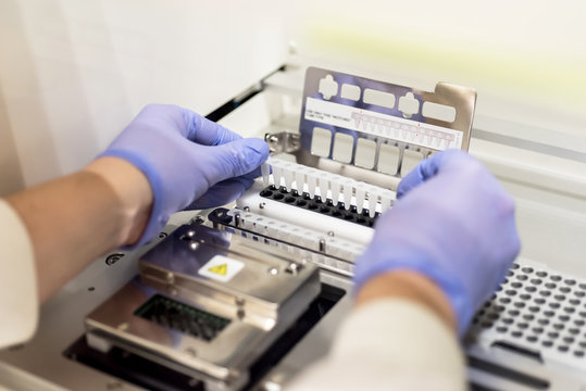 Scientist using a nanostring machine