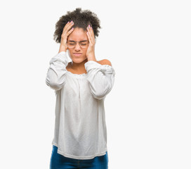 Fototapeta na wymiar Young afro american woman wearing glasses over isolated background suffering from headache desperate and stressed because pain and migraine. Hands on head.