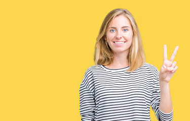 Beautiful young woman wearing stripes sweater over isolated background showing and pointing up with fingers number two while smiling confident and happy.