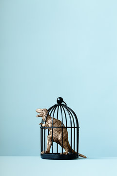 Dinosaur trapped in a cage