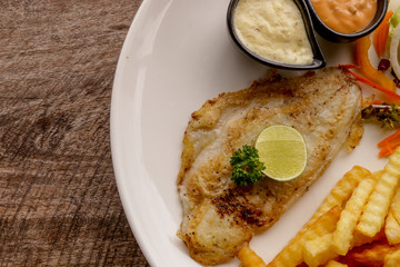 Hot Fish Steak on wooden table