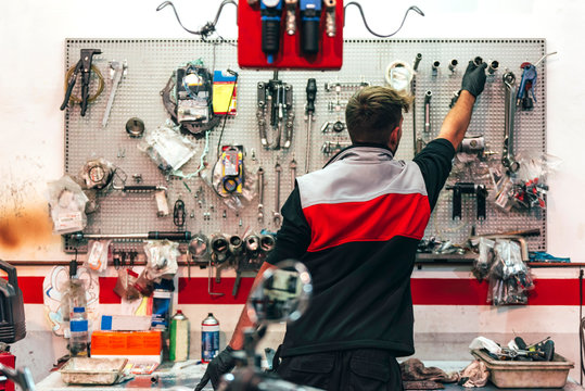 Mechanic working in the motorbike workshop
