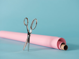 Shiny scissors and pink paper