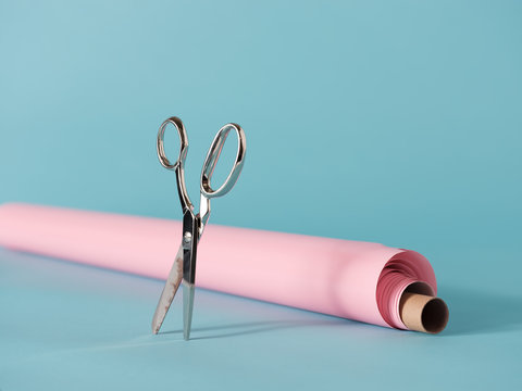 Shiny scissors and pink paper