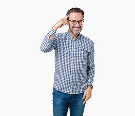Handsome middle age elegant senior man wearing glasses over isolated background Smiling pointing to head with one finger, great idea or thought, good memory