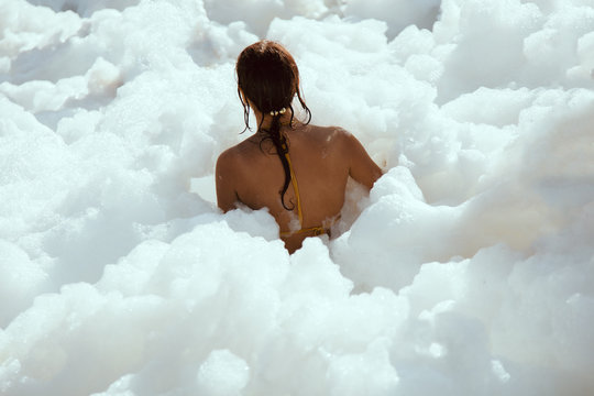 young woman  in the foam clouds