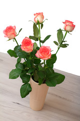 Beautiful bouquet of pink roses in ceramic vase.