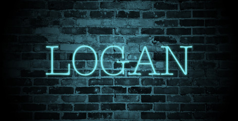 first name Logan in blue neon on brick wall