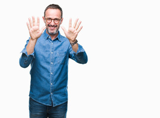 Naklejka premium Middle age hoary senior man wearing glasses over isolated background showing and pointing up with fingers number ten while smiling confident and happy.