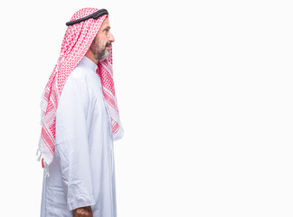 Senior arab man wearing keffiyeh over isolated background looking to side, relax profile pose with...