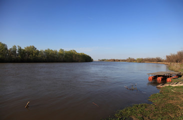 A natural blurred landscape of the river in autumn at sunset. Astrakhan Region, Russia