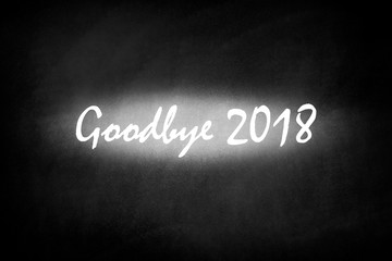 The words goodbye 2018 on blackboard 