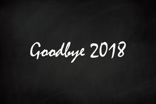 The words goodbye 2018 on blackboard 