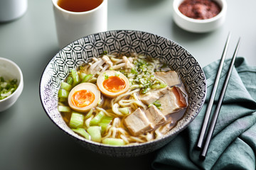 Bowl of ramen with bok choy, shimeji mushrooms, pork belly and s