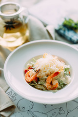 The Caesar salad and the classic shrimp. Restaurant dishes with a beautiful serving.
