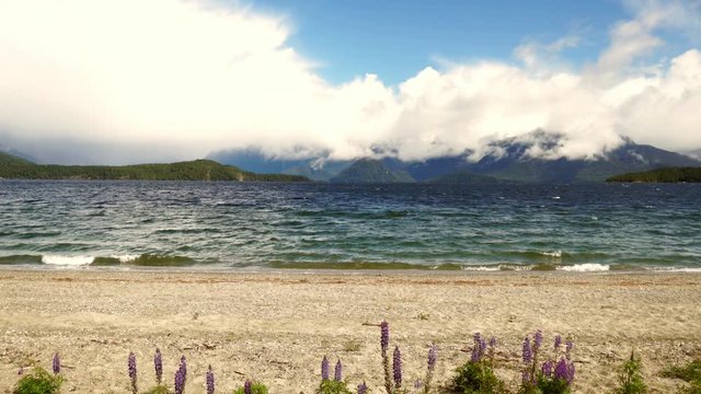 timelapse of manapouri lake fjord, seeing the cloud forming and cloud coming in.
