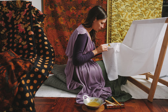 Female Artist Doing Batik Technique On The Piece Of Cloth