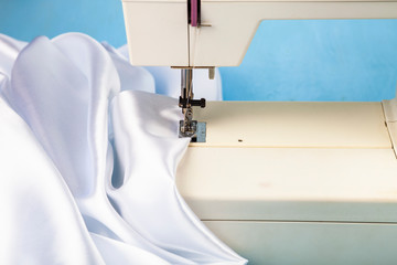 Sewing machine and white satin