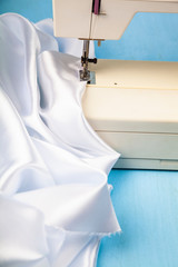 Sewing machine and white satin