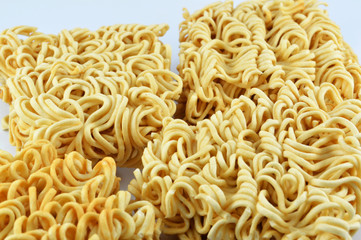 instant noodles isolated / close up of raw yellow instant noodles ready for food