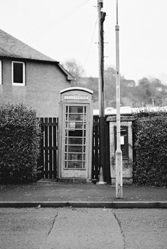 British style phone box in a residential street in the UK.