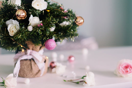 close up detail of mini xmas tree with real roses