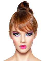 Beautiful woman with creative hairstyle and vivid make-up.