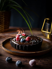 Tart Chocolate cheesecake with fresh berries. delicious dessert for Birthday.
