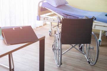Wheelchair and bed of patient Room in the hospital ,healthy and life concept