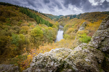 Beauitful view into the Ourthe valley at autumn time of year from rocky cliff Ardennes