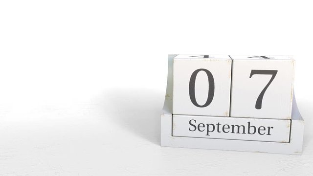 Wood cube calendar shows September 7 date, 3D animation