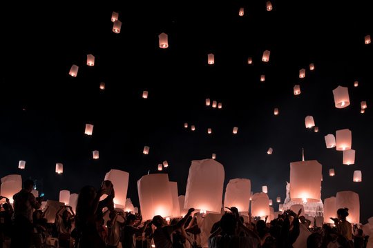 Chiang Mai Thailand white lantern to release in the sky during Loi Krathong Yee Peng Festival, lantern isolated in the night sky