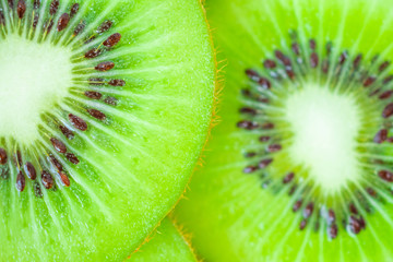 Fresh kiwi fruit slices closeup macro background