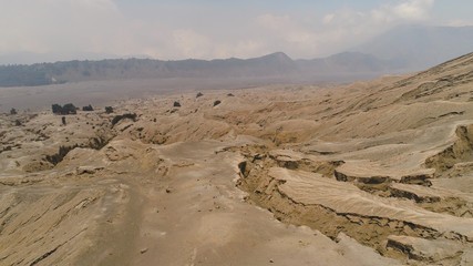 Volcanic landscape around volcano. aerial view mountainous relief after volcanic eruption Bromo Tengger Semeru national park Java, Indonesia.
