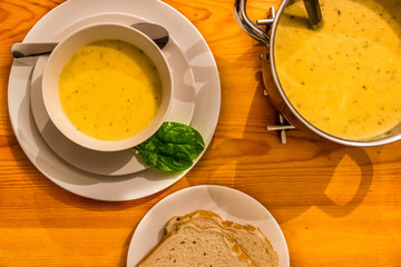 A minimalist dinner with cream and slice of bread