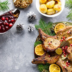 Christmas dinner with roasted meat steak, Christmas Wreath salad, baked potato, grilled vegetables, cranberry sauce.