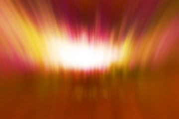 Designed film texture background with heavy grain, dust and a light leak. Blurred defocused bright light. Lens flare. Shiny spots. Looks like aurora lights in the middle of the screen, red tones.