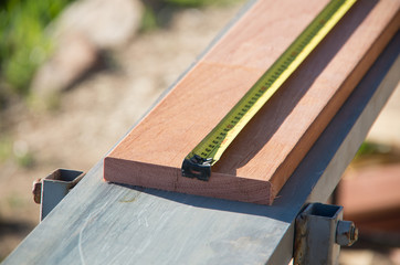 Measuring a plank of wood