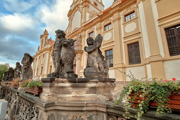 Fototapeta na wymiar Angels statues at Loreto Prague (Loreta Praha) church monastery pilgrimage in Prague, Czech Republic
