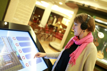 Woman using touch screen