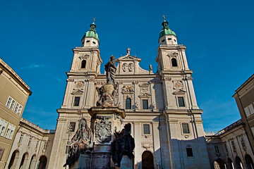 Fototapeta premium Salzburg Cathedral or Salzburger Dom with the fountain is the 17-th century baroque roman catholic church in Salzburg, Austria. Salzburg Cathedral is dedicated to St Rupert and St Vergilius