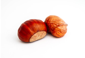 One roasted chestnut, isolated on white background. Peeled chestnut, close up.