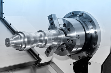 Metal detail in a spindle of the industrial lathe. Blue toned.