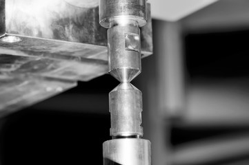 Copper contacts of electric welding machine. Black and white toned